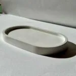 Διακοσμητικός δίσκος οβάλ 17,7 cm από γύψο, με λείο φινίρισμα και κομψό σχεδιασμό. Ιδανικός για διακόσμηση χώρου ή πρακτική χρήση σε κάθε σπίτι.